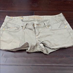 Guess olive shorts. With stud details